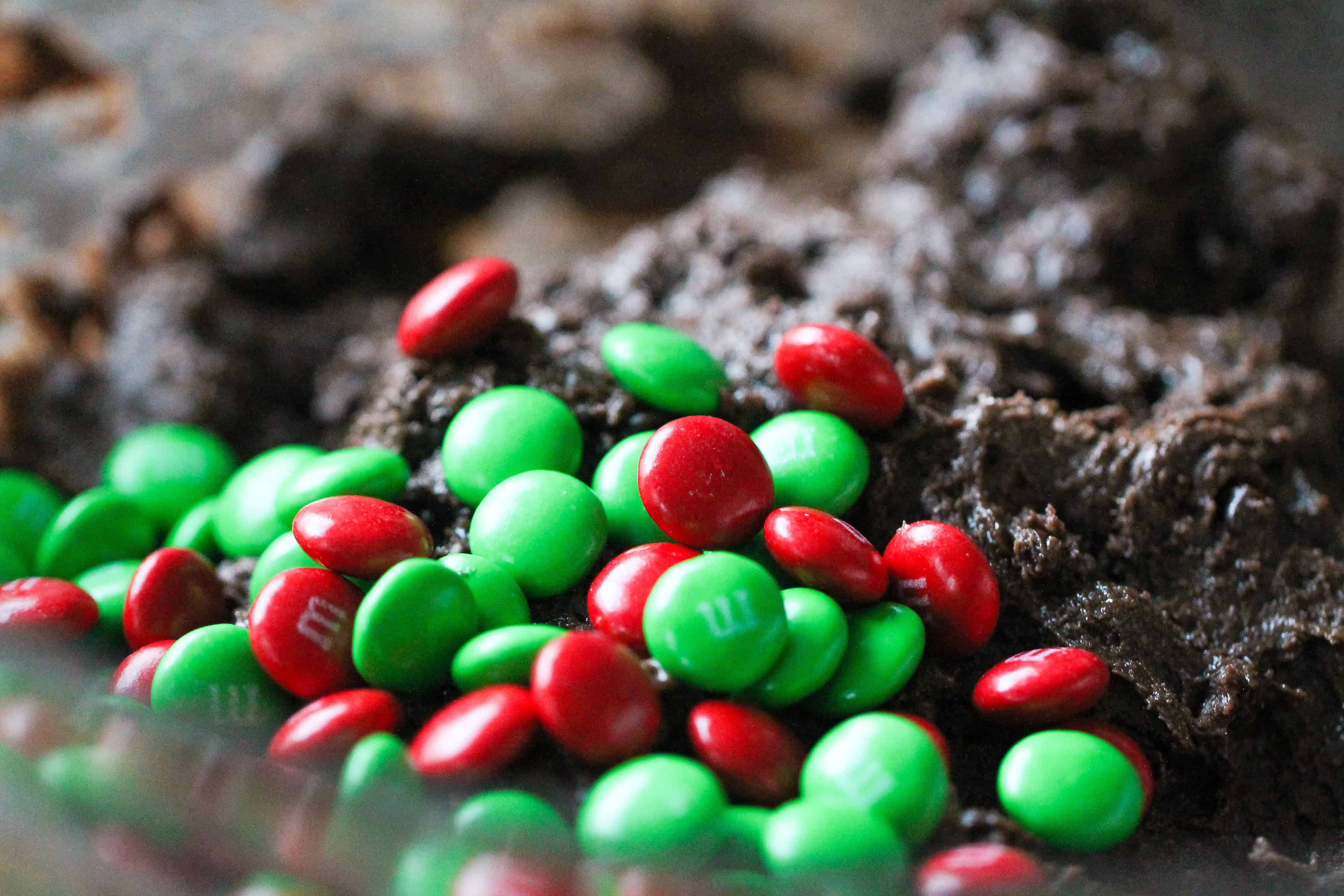 M&M's getting mixed into cake cookie dough