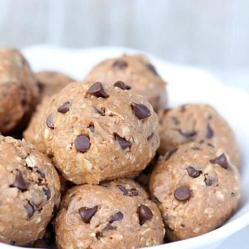 Chocolate protein energy bites in a white bowl.