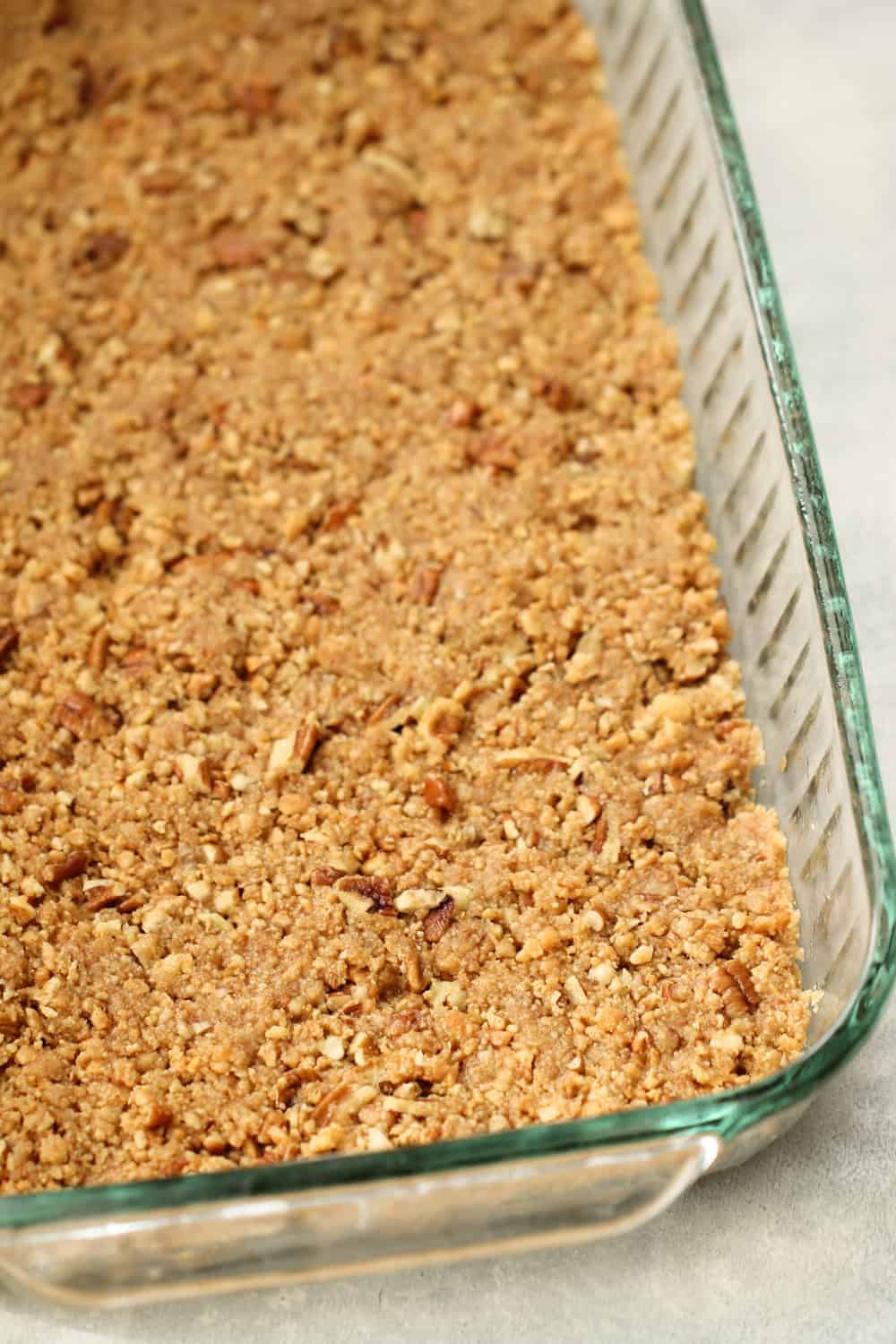 crust of layered cherry cheesecake baked in a pan