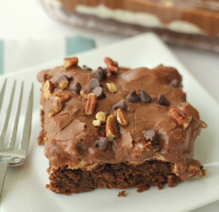 Slice of Mississippi Mud Cake on a plate with a fork.