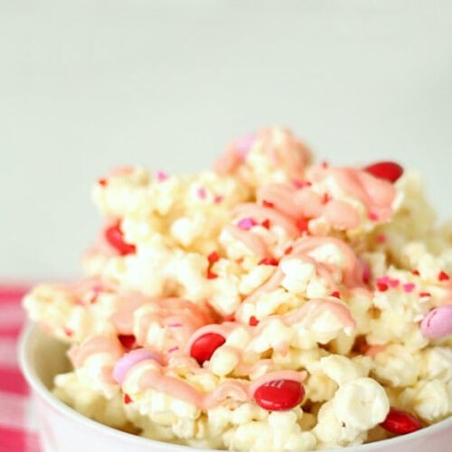 Valentine’s Day White Chocolate Popcorn in a white bowl.