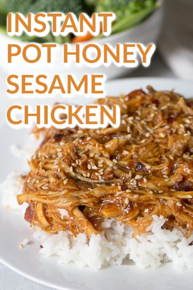 Instant Pot Honey Sesame Chicken served over rice with a salad on the side