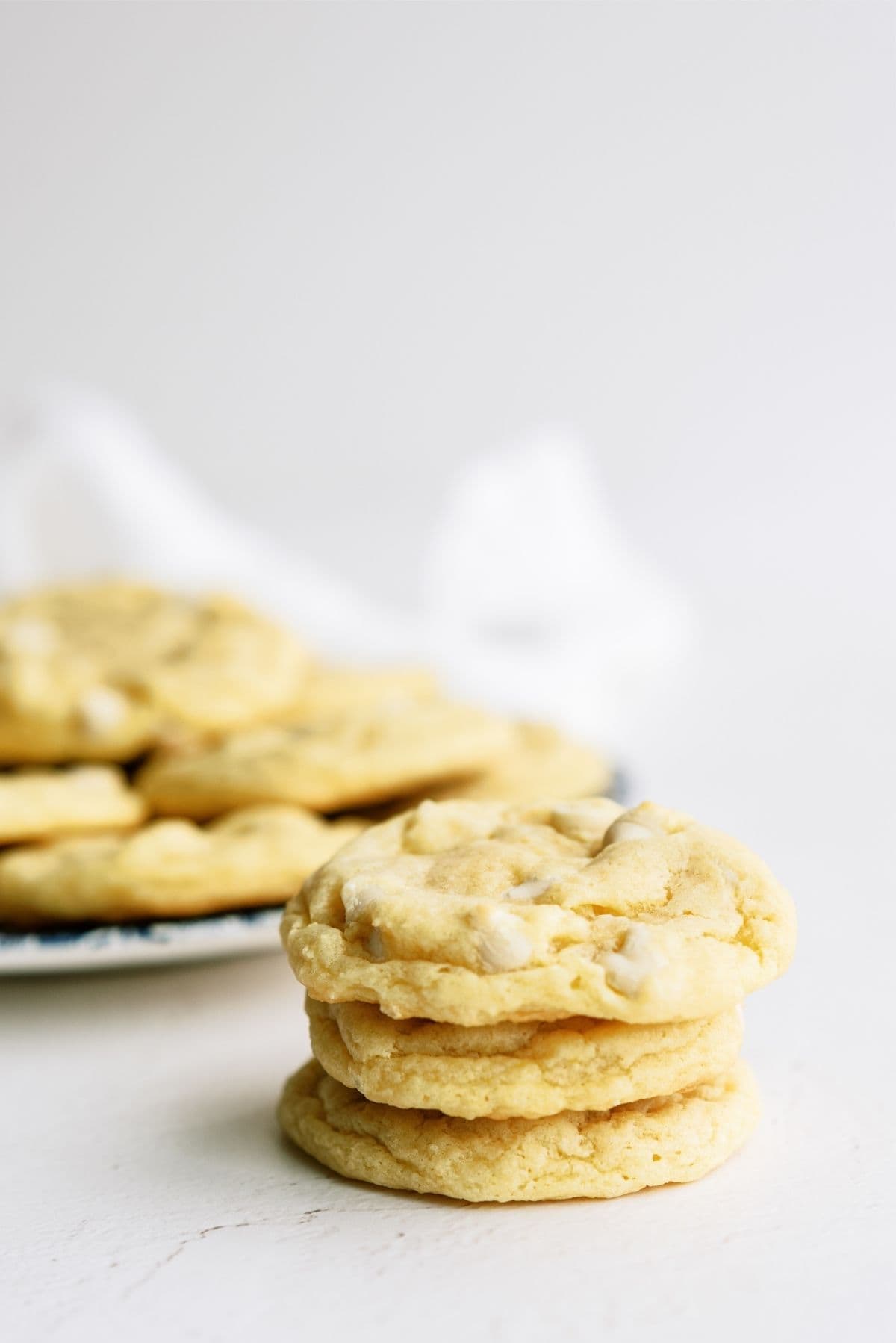 Lemon Cheesecake Pudding Cookies stacked on a plate