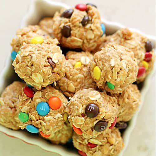 No Bake Oatmeal Peanut Butter Balls with M&M's in a white dish.