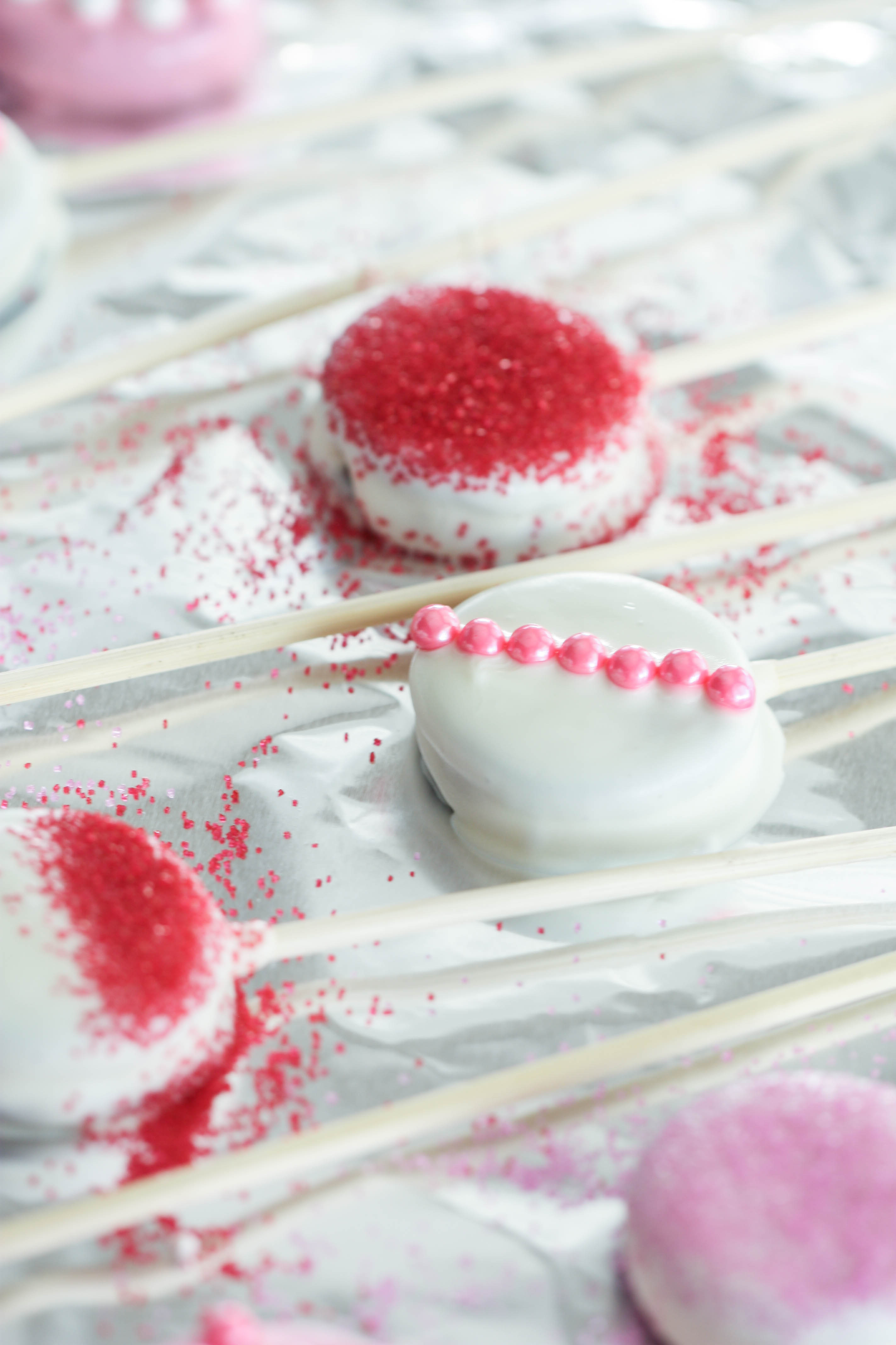 Valentine’s Day Cookie Pops on wax paper