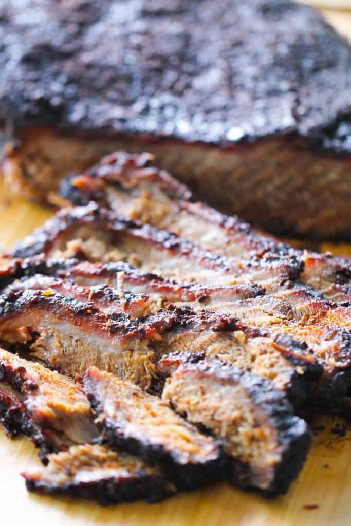 Easy Smoked Brisket sliced on a cutting board