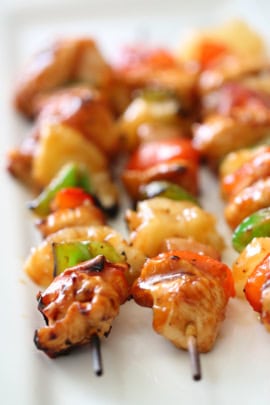 Hawaiian BBQ Chicken Kabobs lined up on platter