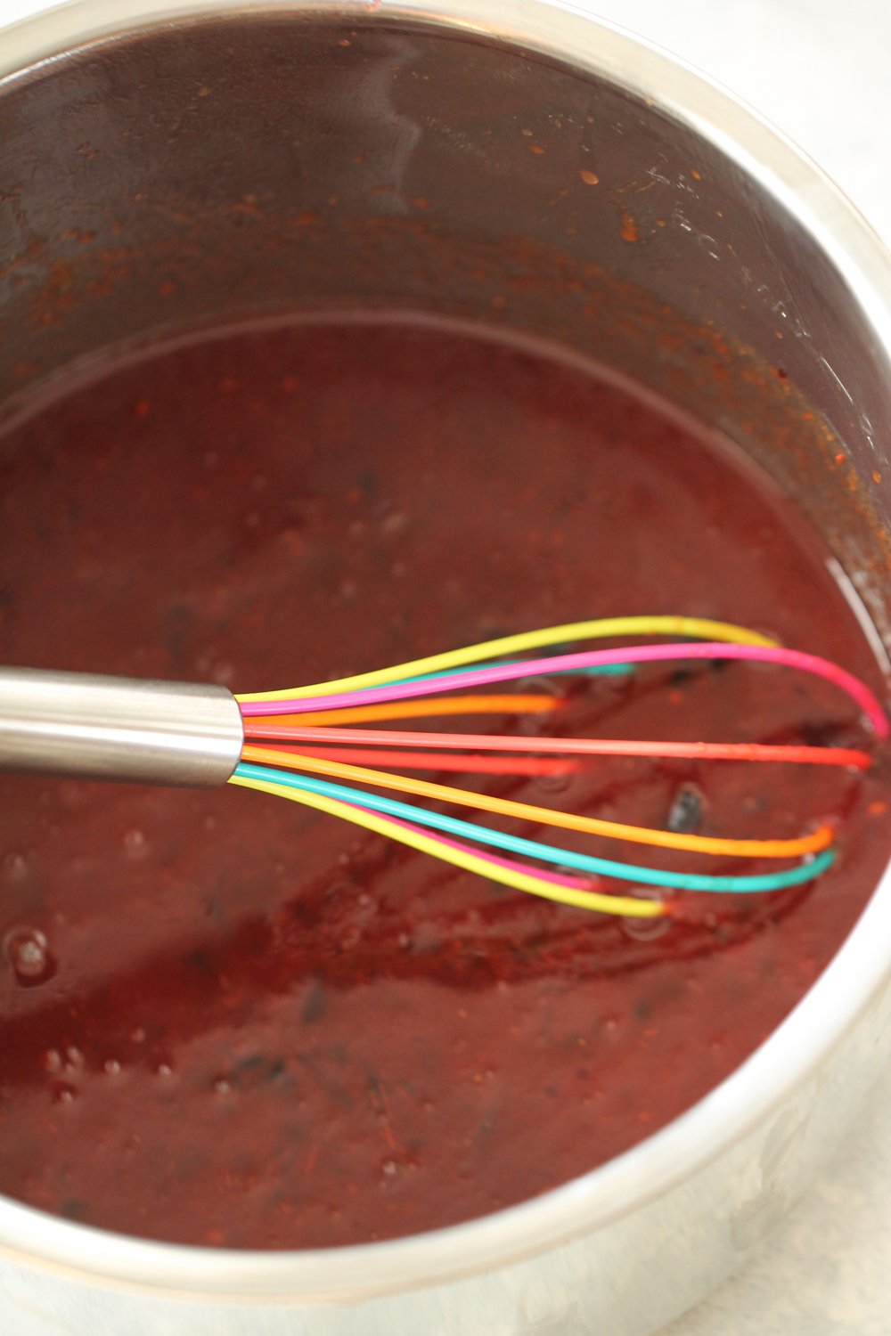 Whisking together the jelly and chili sauce
