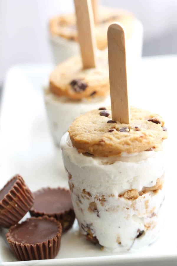 Reese’s Cookie Ice Cream Pops on a serving tray with mini reeses.