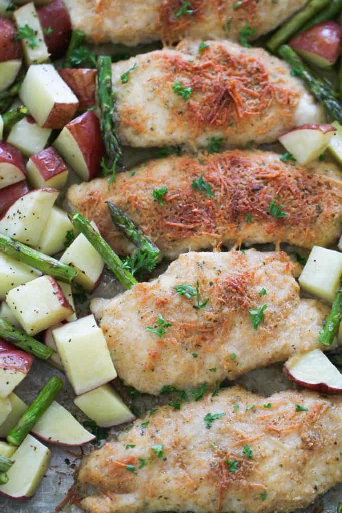 Parmesan Chicken on a sheet pan with potatoes and asparagus