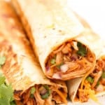 bbq chicken burrito stacked on a plate