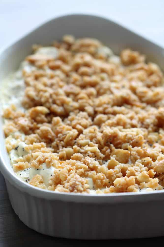 Poppy Seed Chicken Casserole in white casserole dish