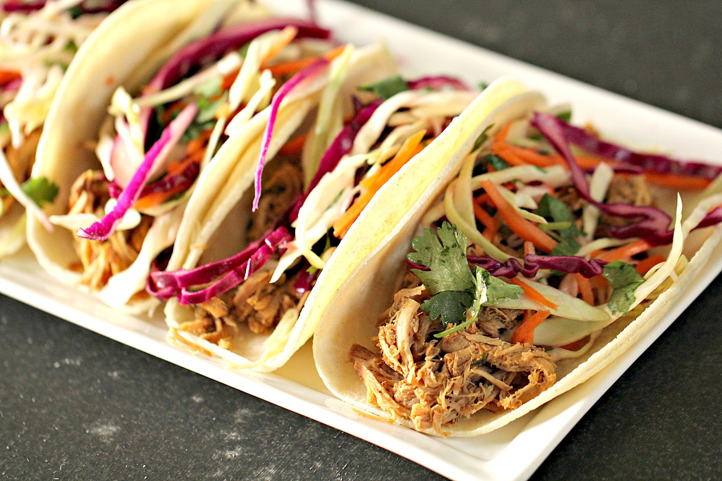 Slow Cooker Cilantro Lime Pork Tacos and Coleslaw on a plate