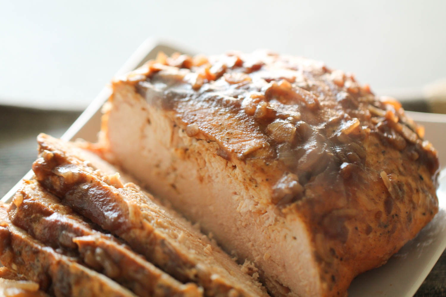 Slow Cooker Cranberry Turkey breast on a serving plate sliced