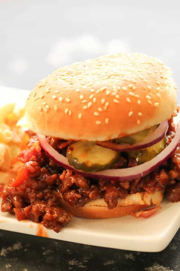 BBQ Pork Sloppy Joes on a plate with a side of macaroni salad