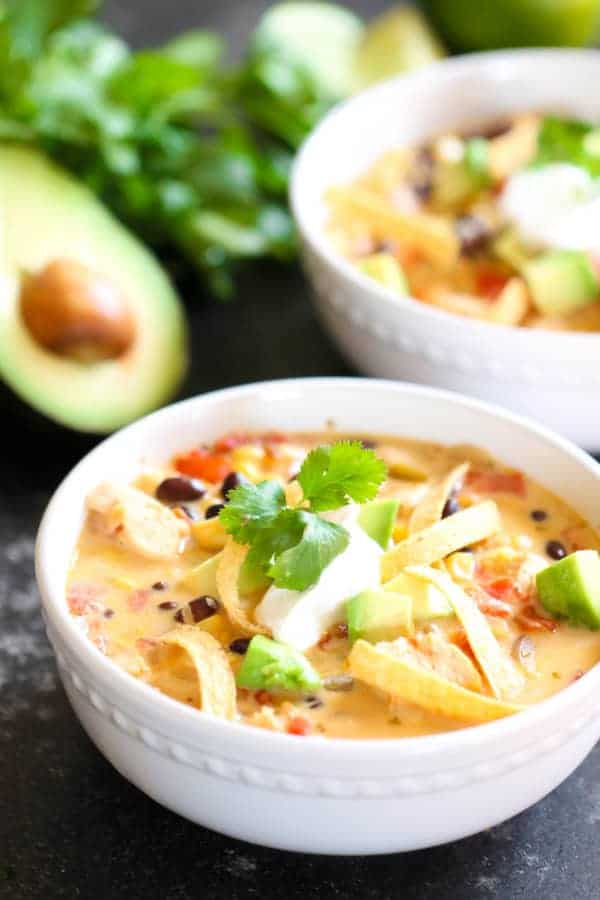 Cheesy Southwest Soup in bowl with toppings
