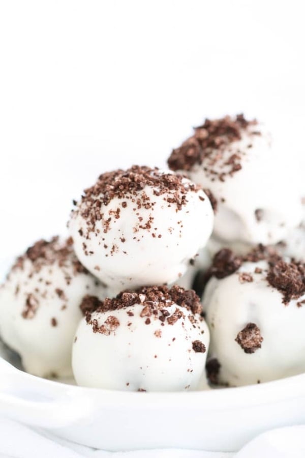 Oreo Cookie Truffles topped with chocolate crumbs in a serving bowl.