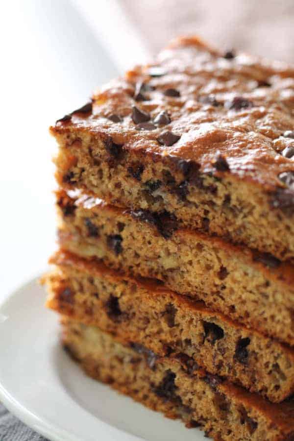 Sheet Pan Healthy Banana Cake cut into squares and stacked