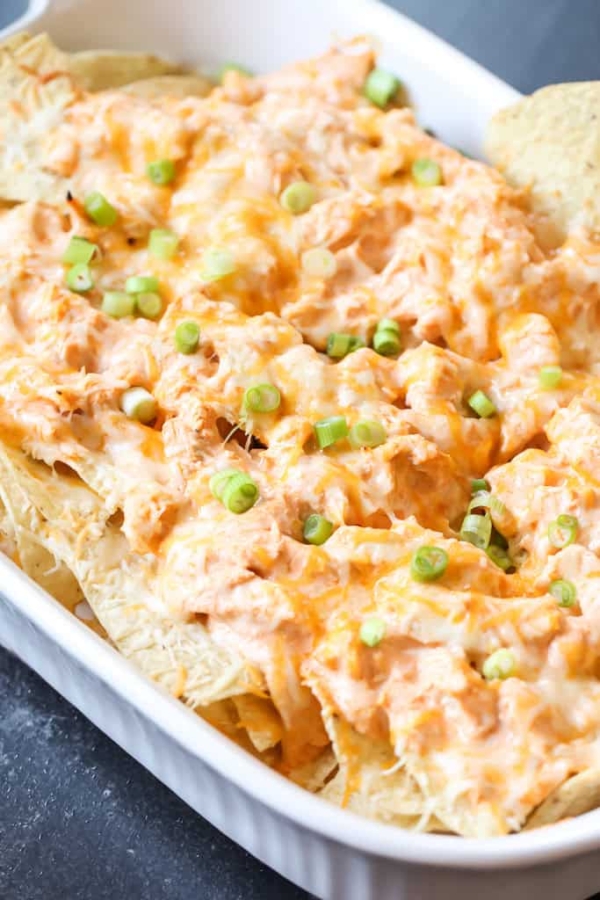 buffalo chicken nachos on a baking sheet