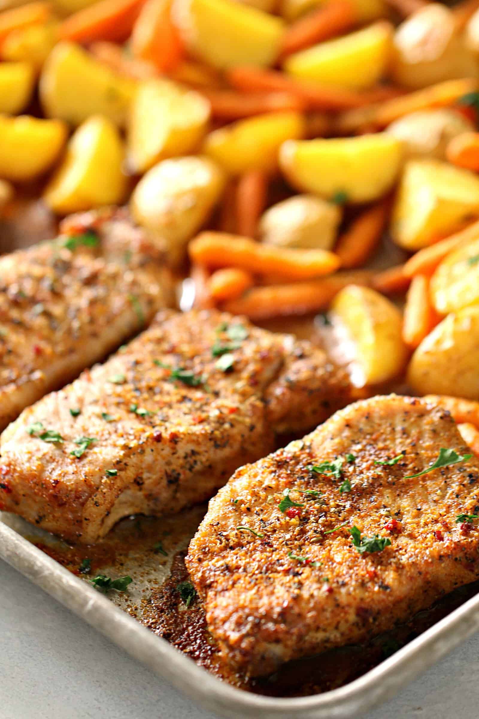 Sheet Pan Italian Pork Chops with potatoes and carrots on sheet pan