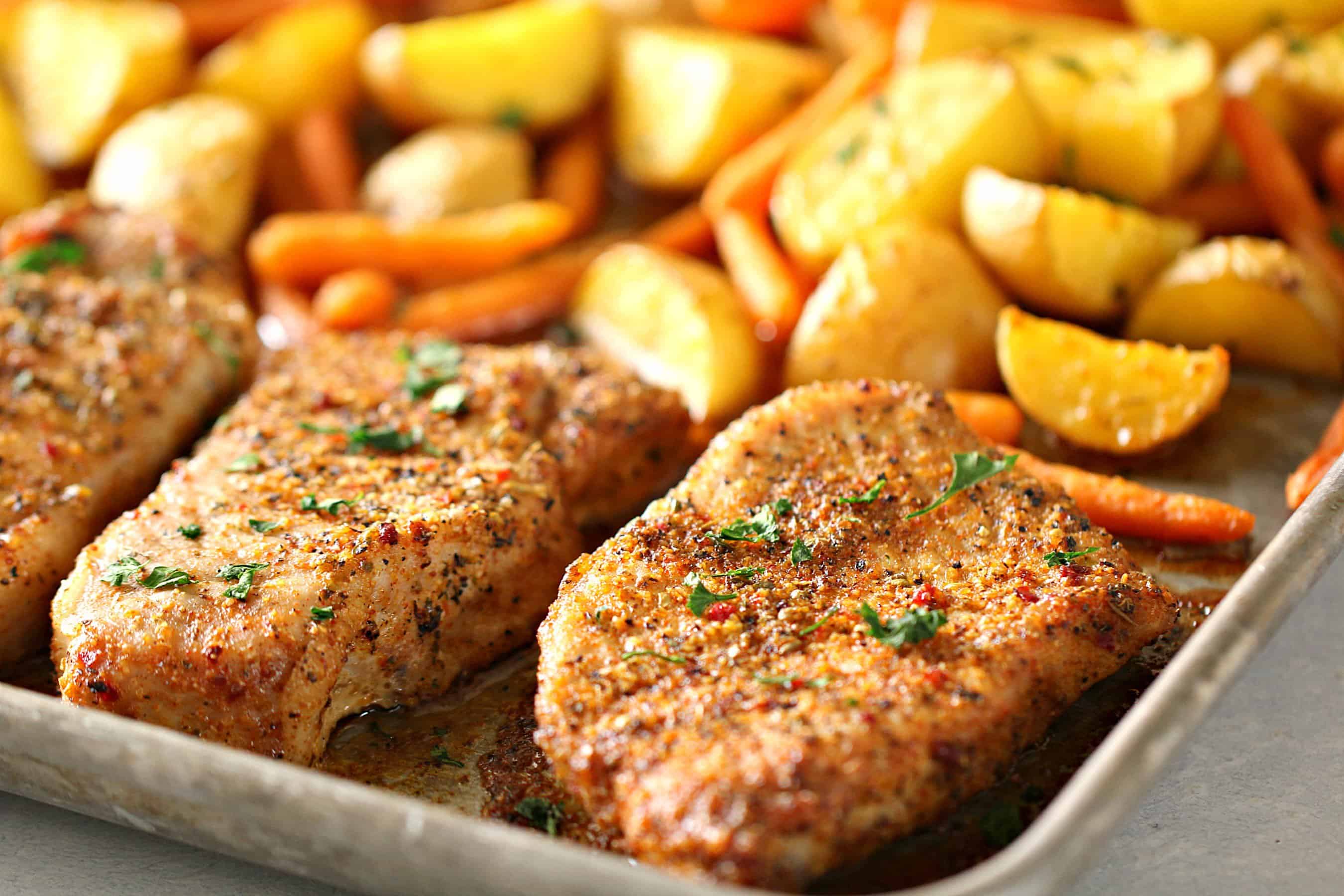 Sheet Pan Italian Pork Chops with potatoes and carrots on sheet pan