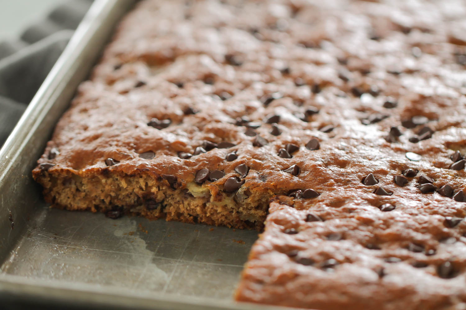 Sheet Pan Healthy Banana Cake with one slice missing