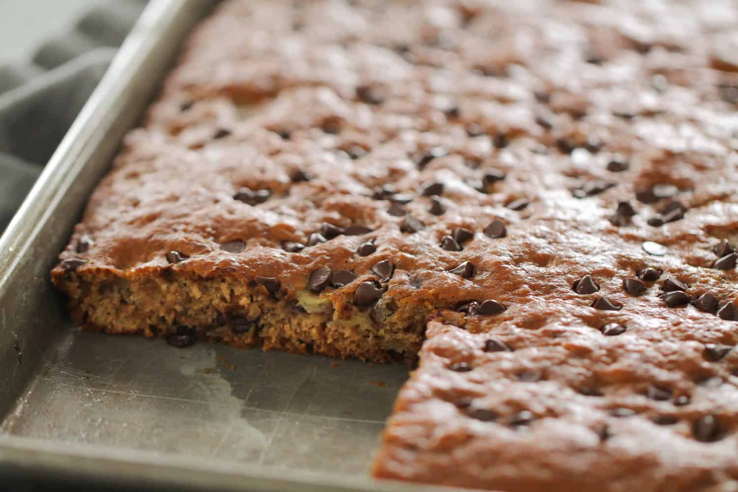 Sheet Pan Healthy Banana Cake with one slice missing