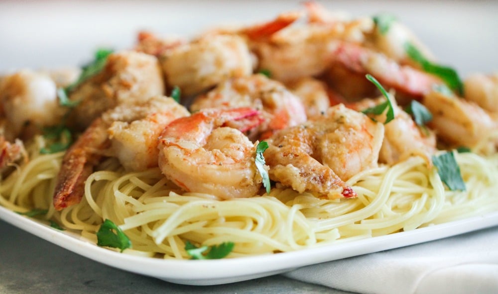 easy shrimp scampi recipe served over angel hair pasta