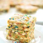 4 Sheet Pan Funfetti Cookie Bars stacked on a plate.