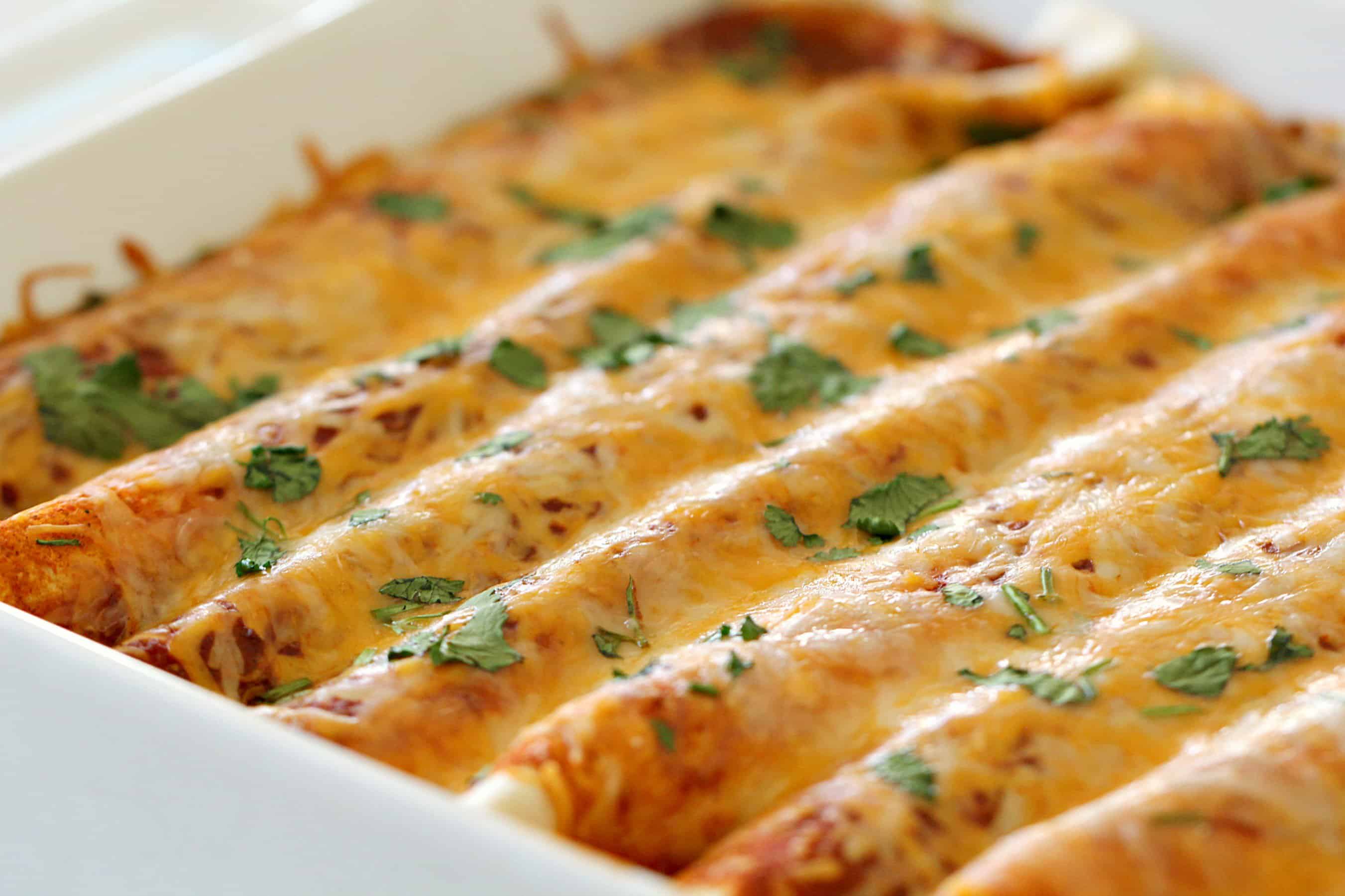 Creamy Three Bean Enchiladas in casserole dish!