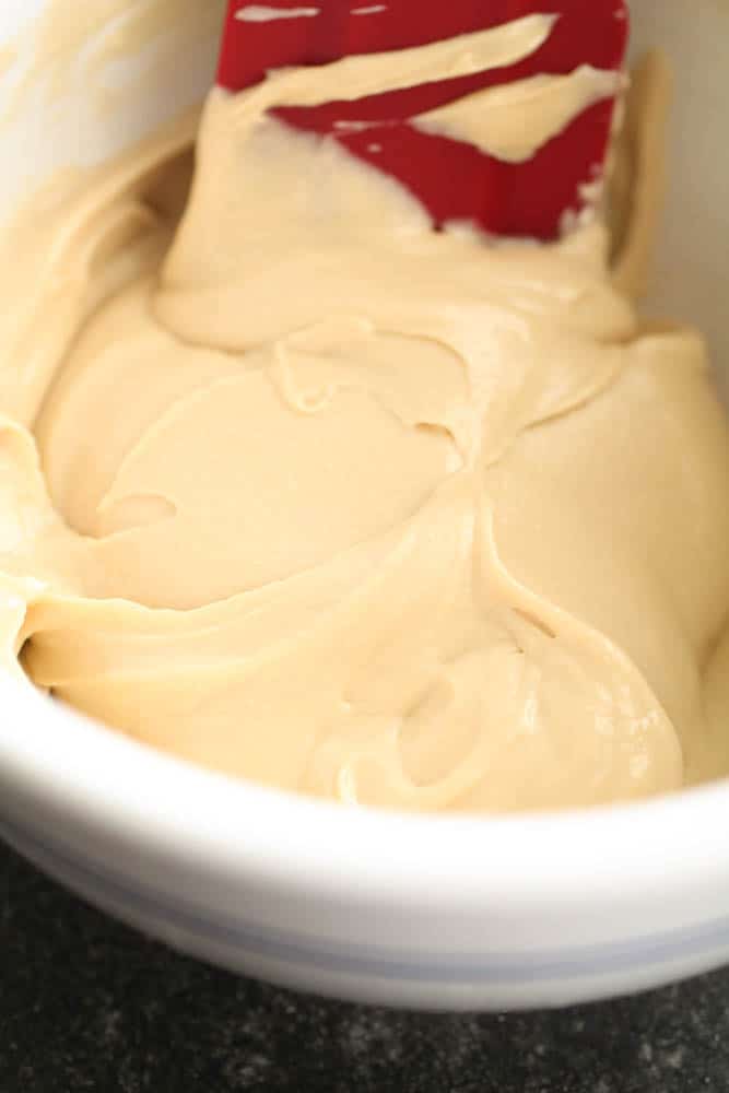 creamy fruit dip in bowl with spatula