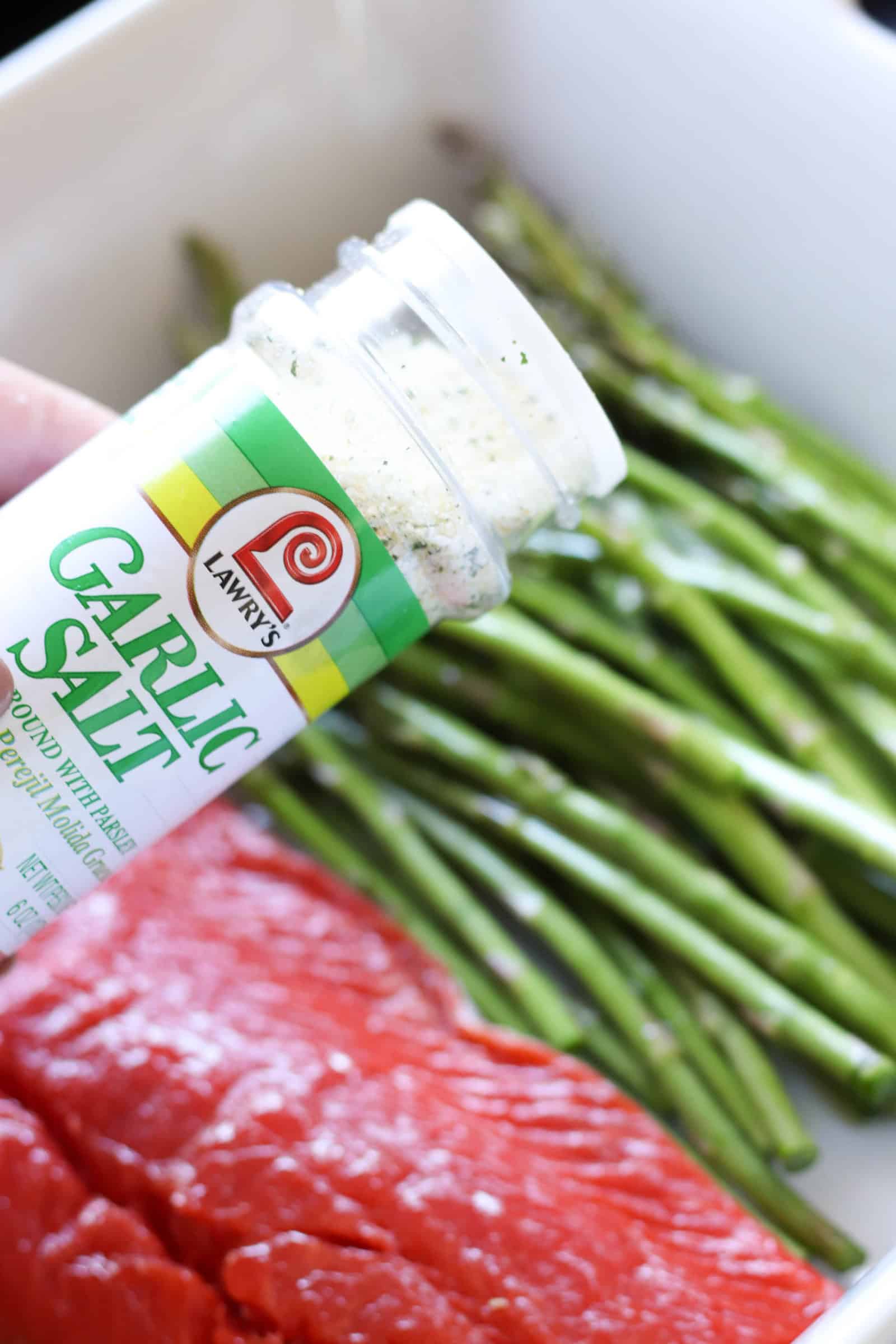 garlic salt sprinkled on raw salmon and asparagus