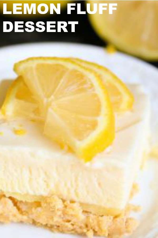 Frozen Lemon Fluff Dessert on a white plate topped with lemon slices