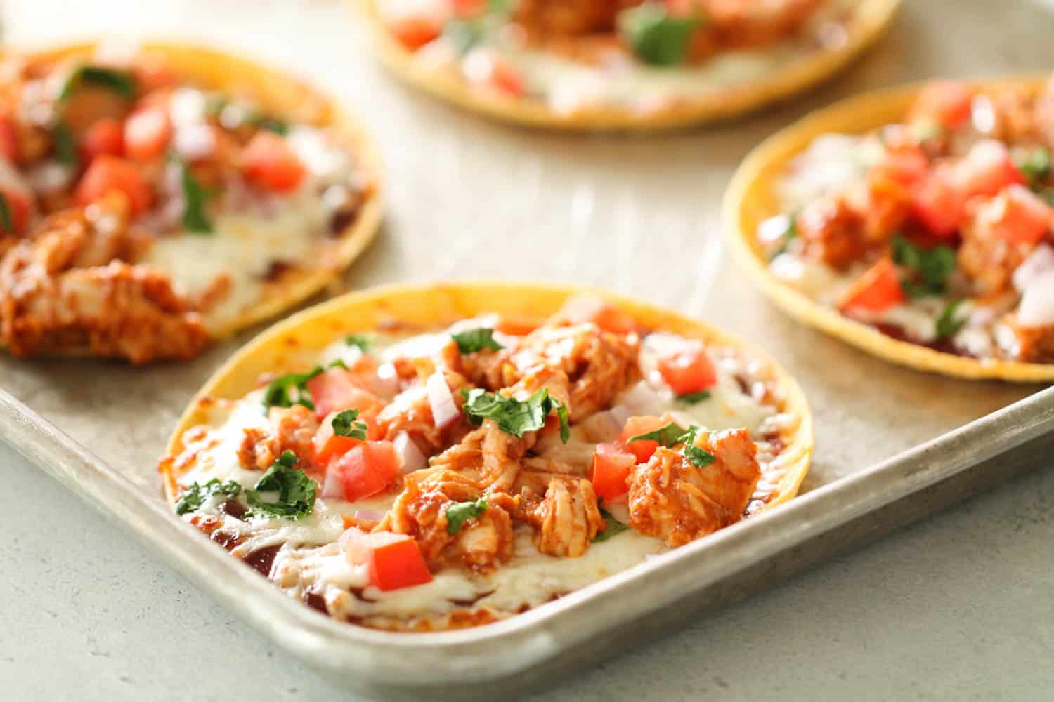 Skinny BBQ Chicken Tostadas on a sheet pan