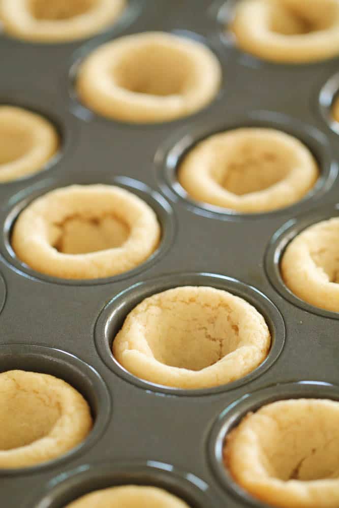 Small sugar cookie cups in a mini muffin tin.