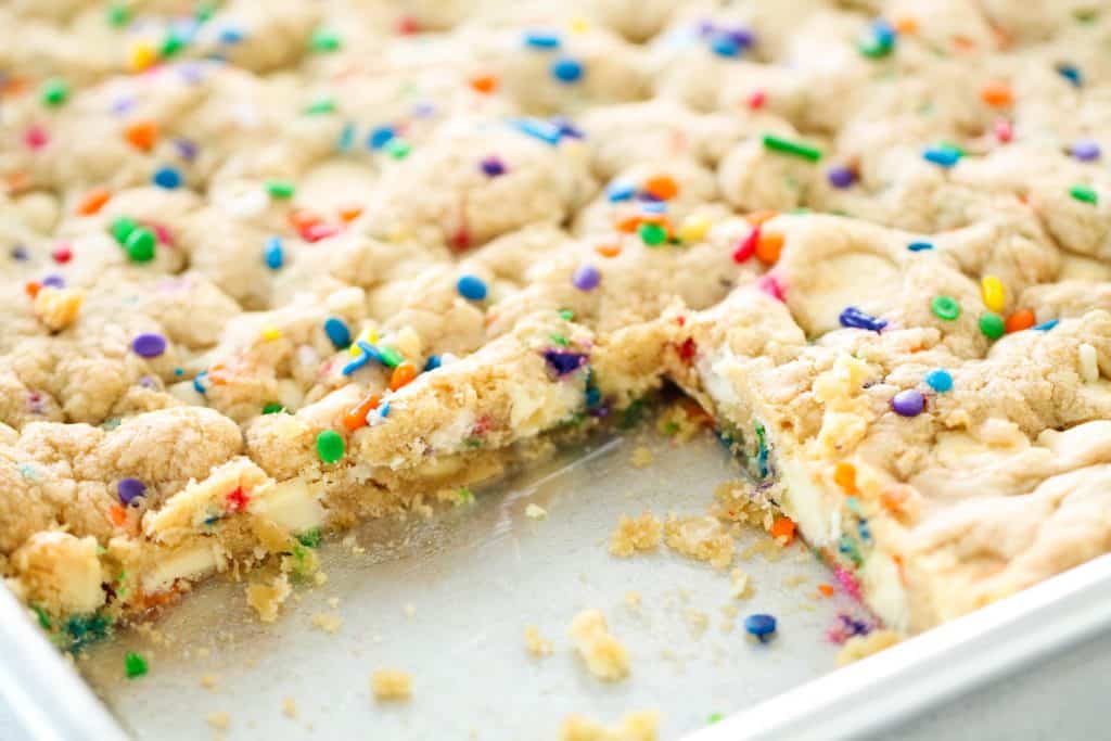 Sheet Pan Funfetti Cookie Bars with a couple bars missing.