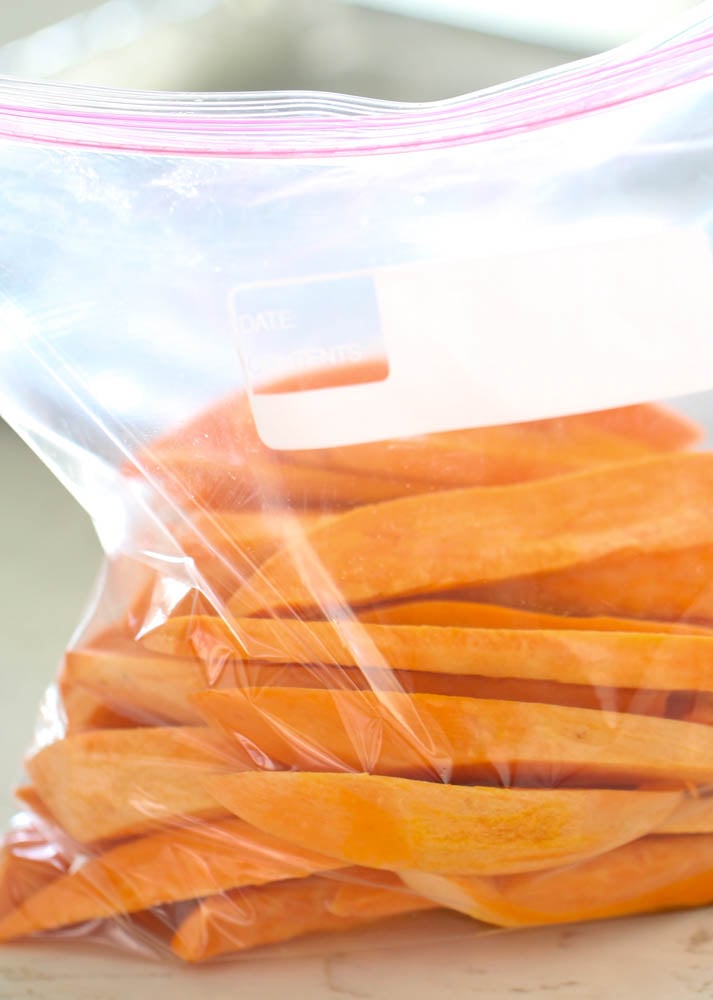 sweet potatoes cut into wedges and placed in a plastic resealable bag