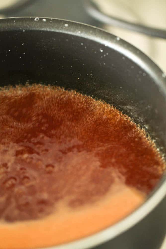 Sweet and Sour sauce bubbling in a sauce pan.