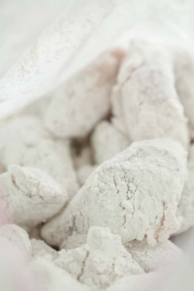 Pieces of cubed pork dredged in cornstarch.