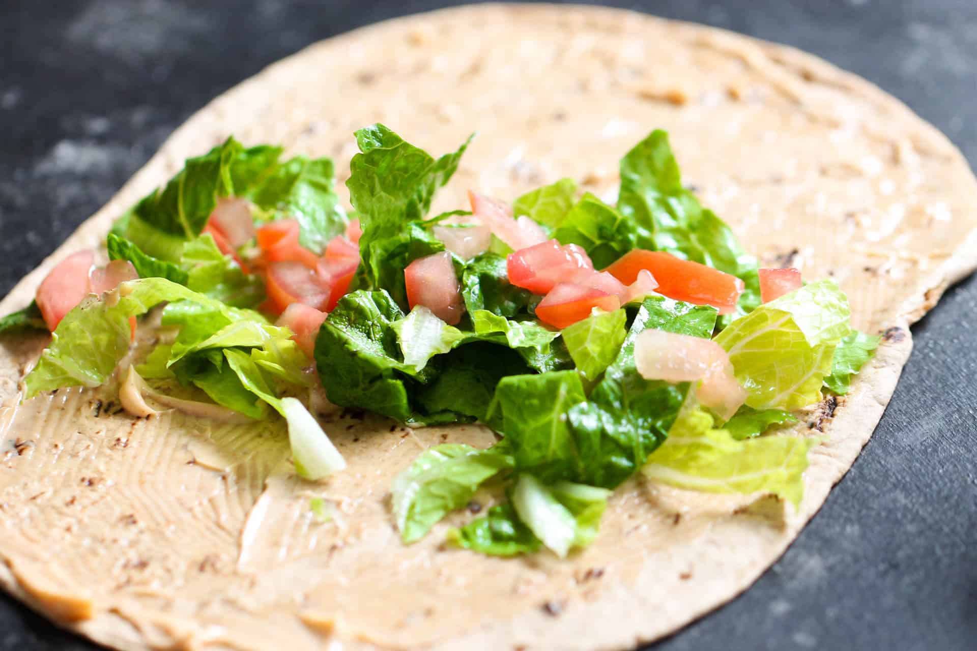 Flat bread with mayo, lettuce and tomatoes