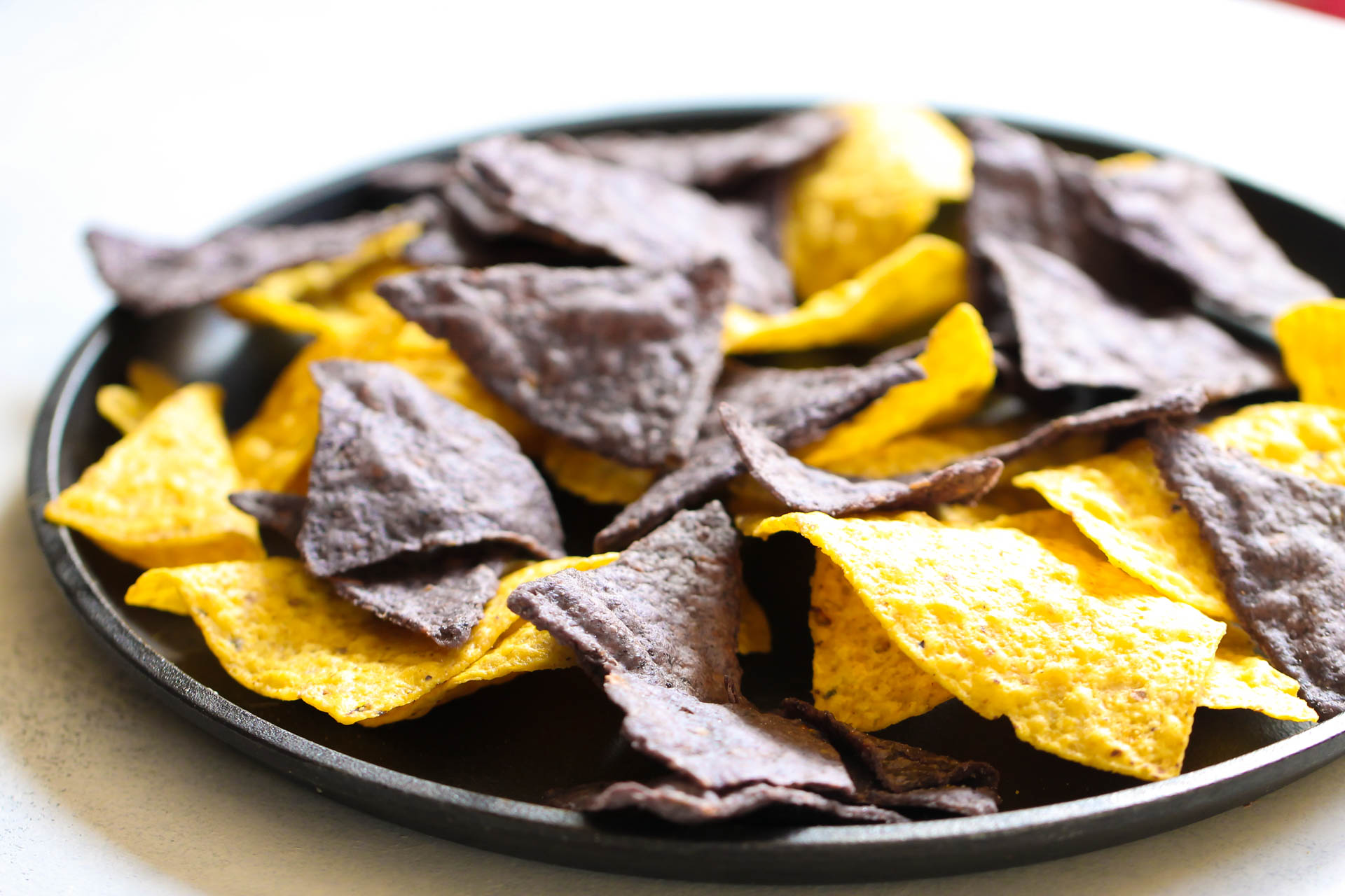 blue and gold corn tortilla chips on a plate