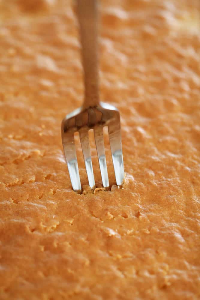 Yellow cake pierced by a fork