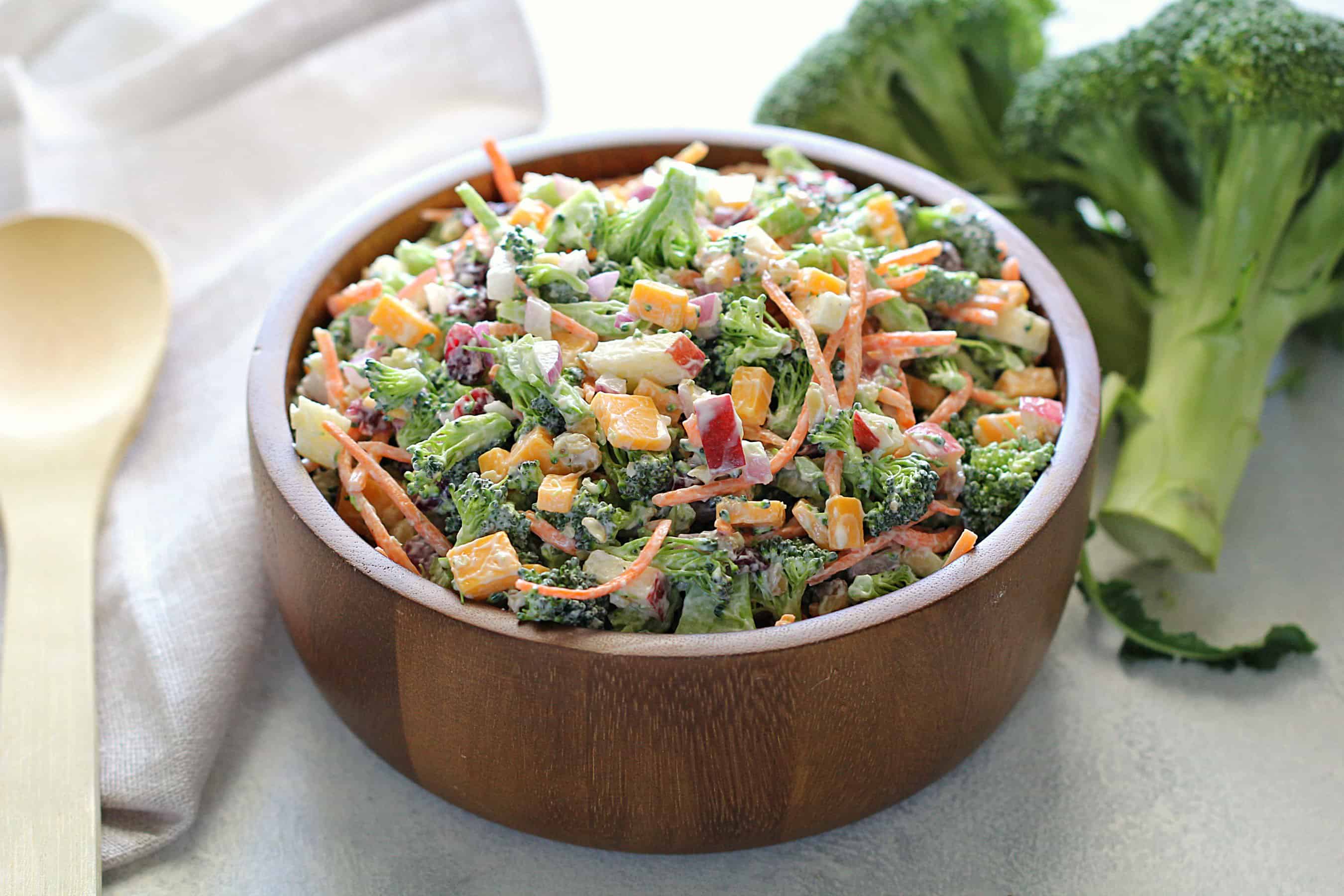 Loaded broccoli salad in wooden bowl