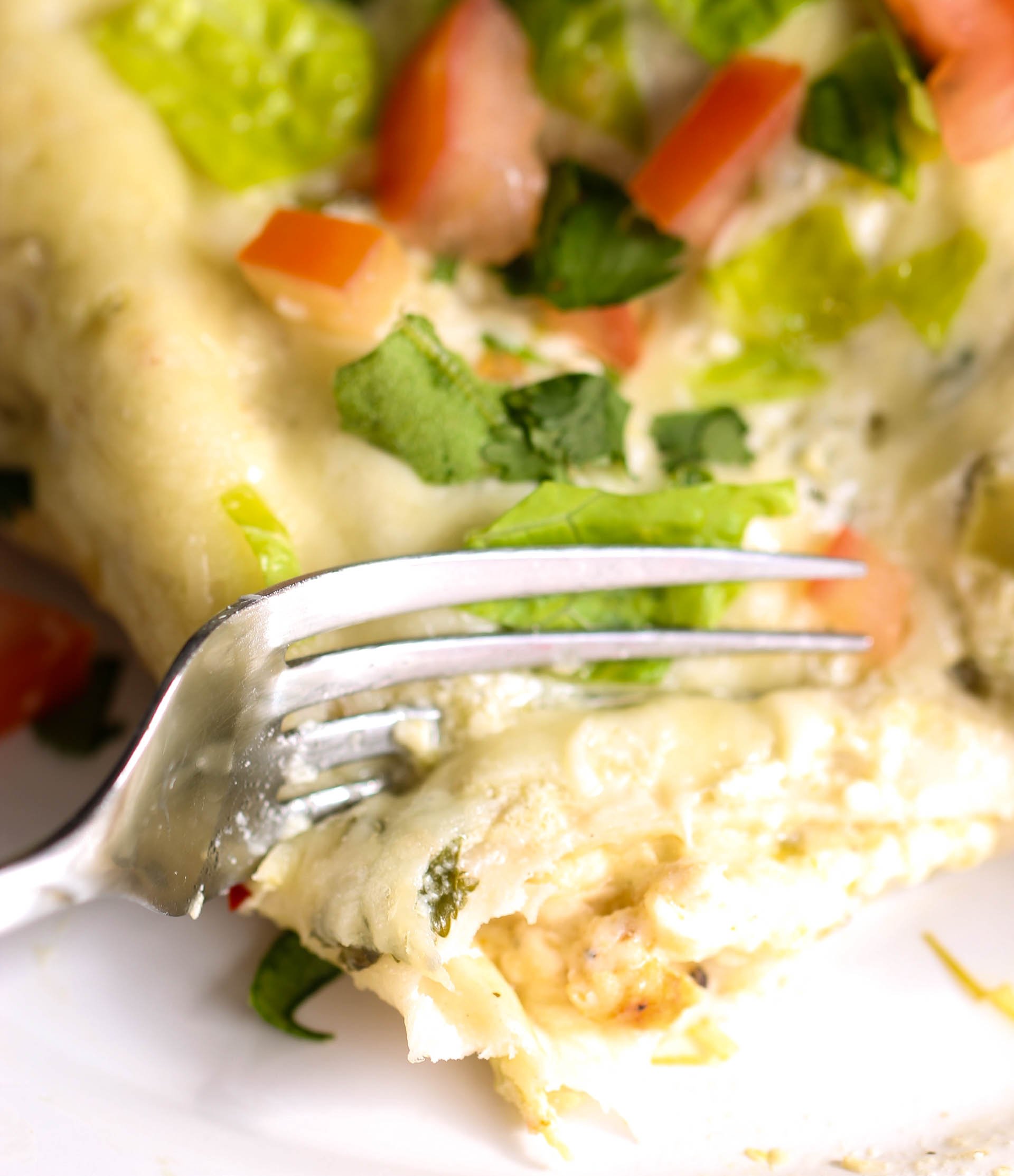 Salsa Verde Enchilada on a plate with a fork