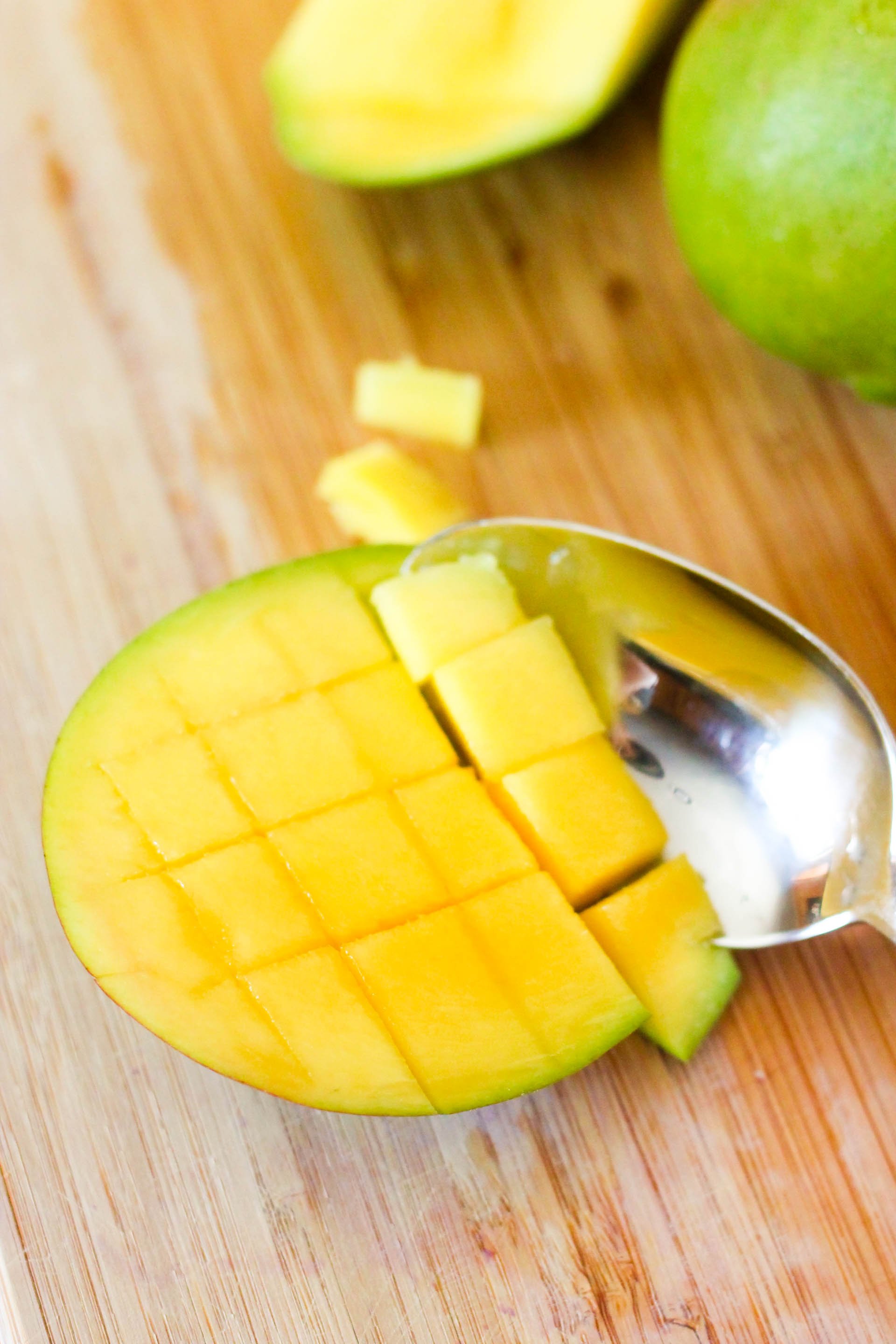 Mango cut in half and cubed