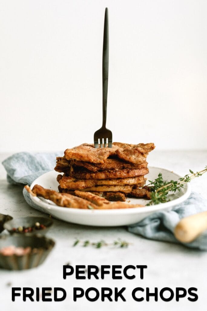 Perfect Fried Pork Chops cooked and stacked on a plate