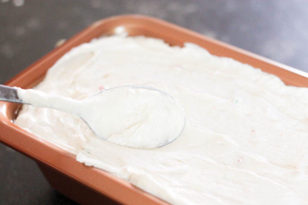 No-Churn Birthday Cake Protein Ice Cream pressed into a pan.