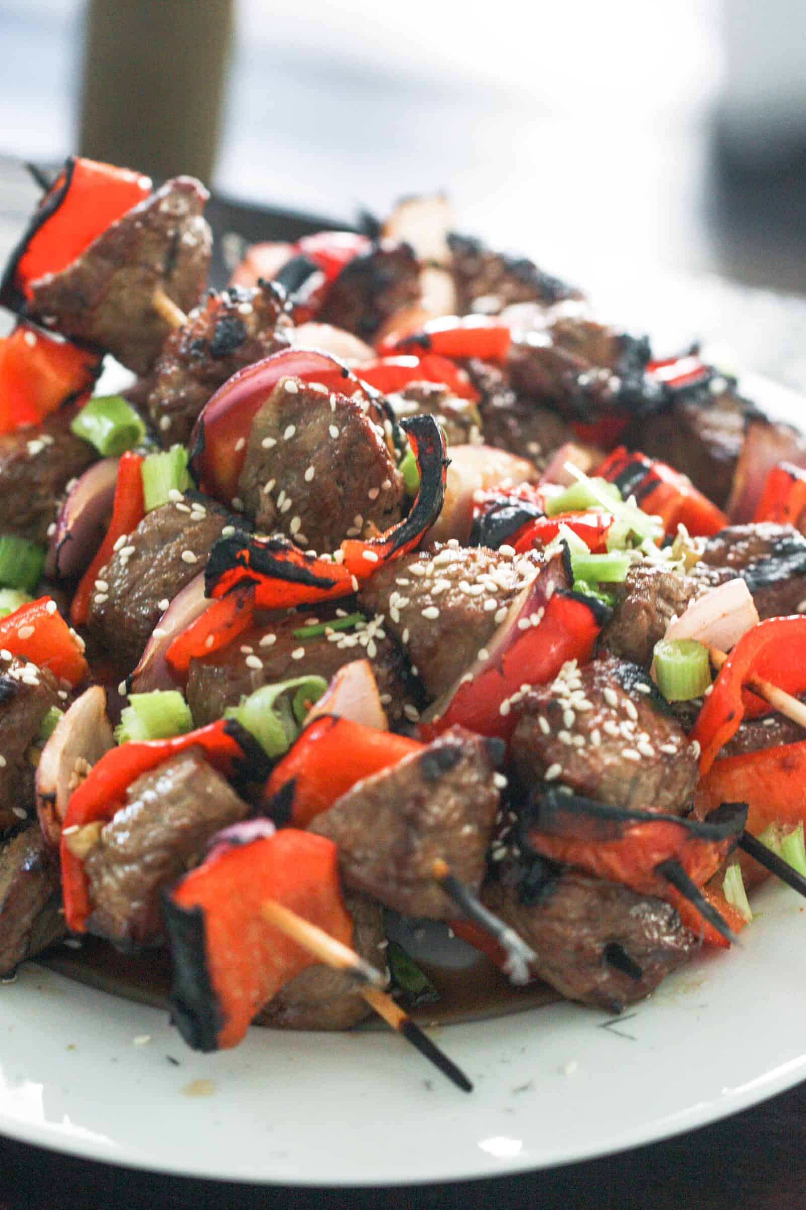 Plate full of Sesame Asian Steak Skewers