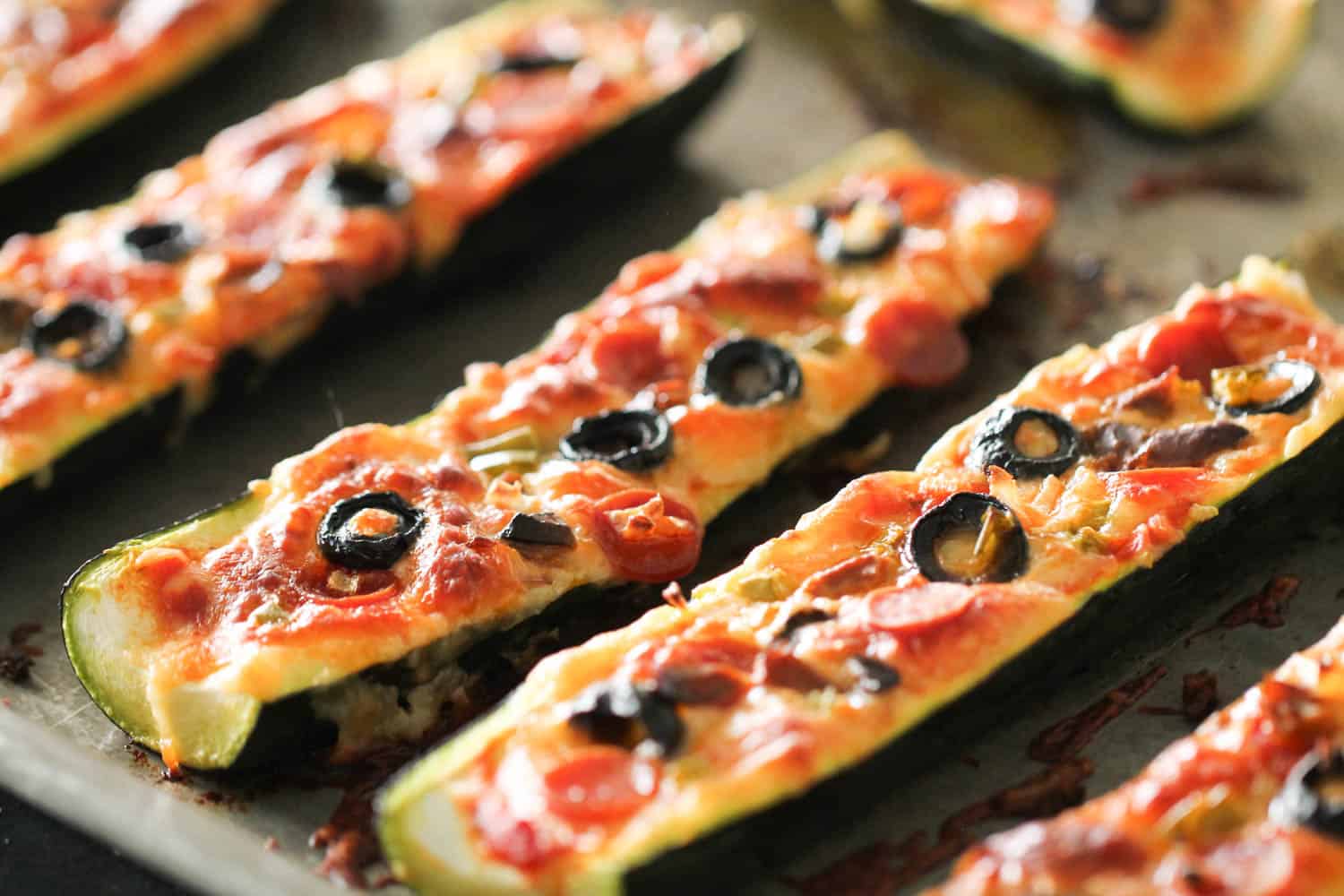 Baked Pizza Stuffed Zucchini Boats on sheet pan