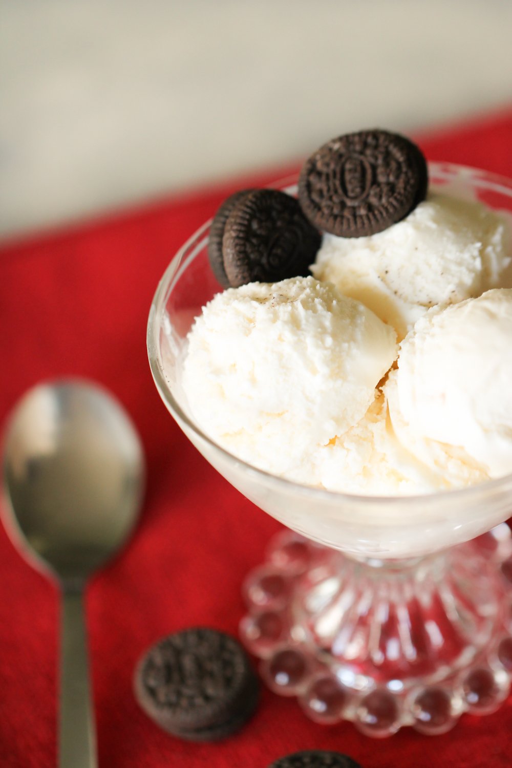 Old Fashioned Homemade Vanilla Ice Cream in an ice cream dish garnished with Oreos